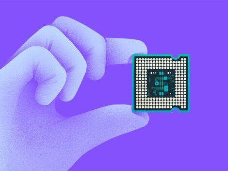 Illustration of a gloved hand holding a semiconductor chip.